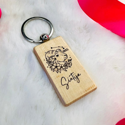 Wooden keychain with personalized engraving.