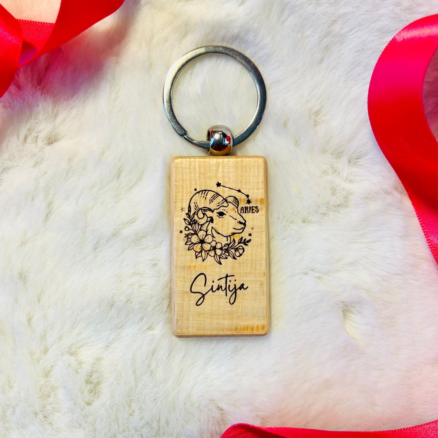 Wooden keychain with personalized engraving.