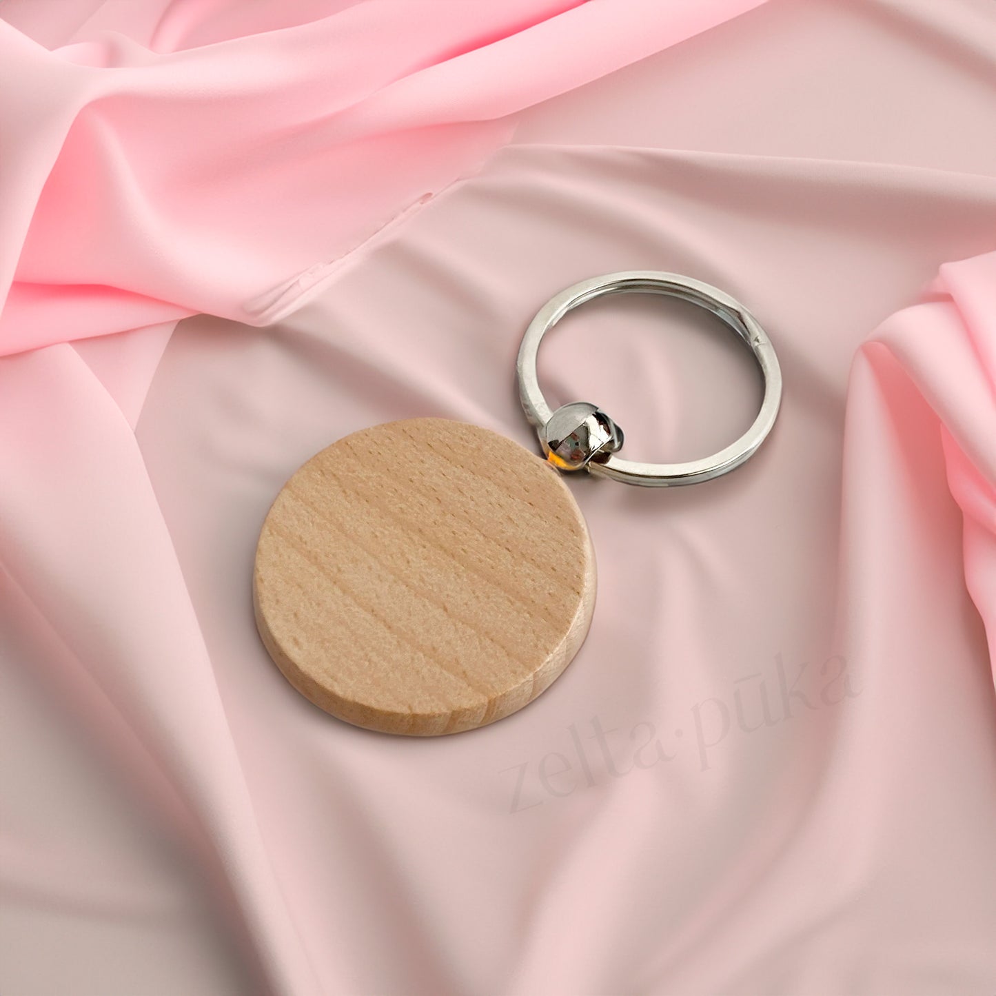 Wooden keychain with personalized engraving.