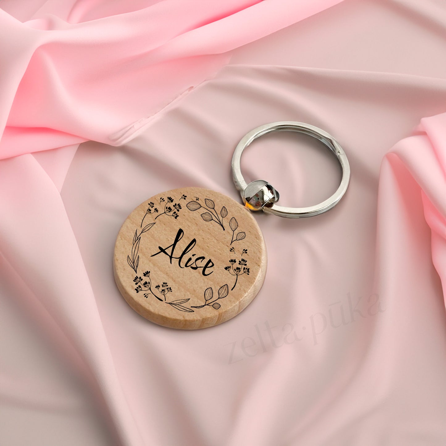 Wooden keychain with personalized engraving.