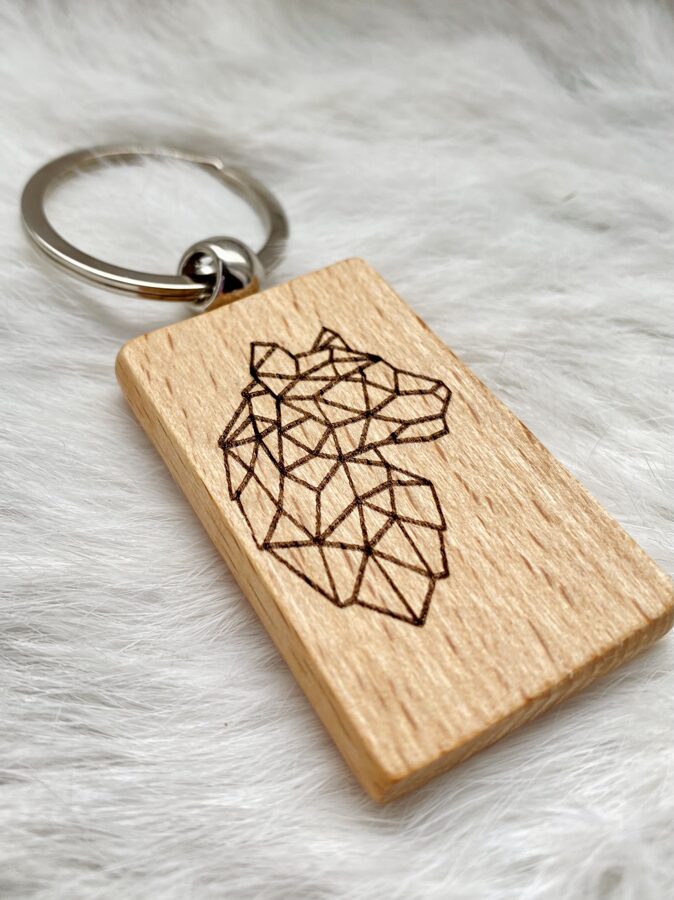 Wooden keychain with personalized engraving.