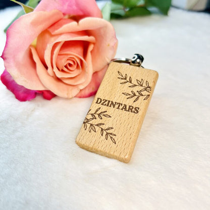 Wooden keychain with personalized engraving.